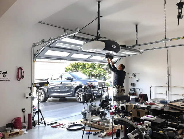Glocester Garage Door Repair specialist installing smart garage door opener system in Glocester home