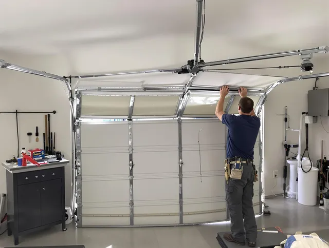 Glocester Garage Door Repair specialist performing precise section replacement on Glocester garage door